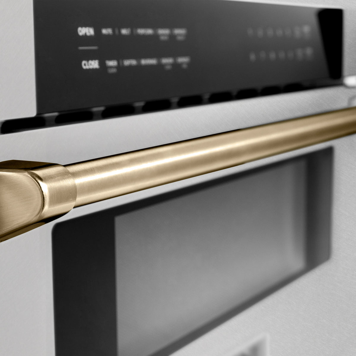 Champagne bronze microwave drawer handle on satin stainless steel front with black glass