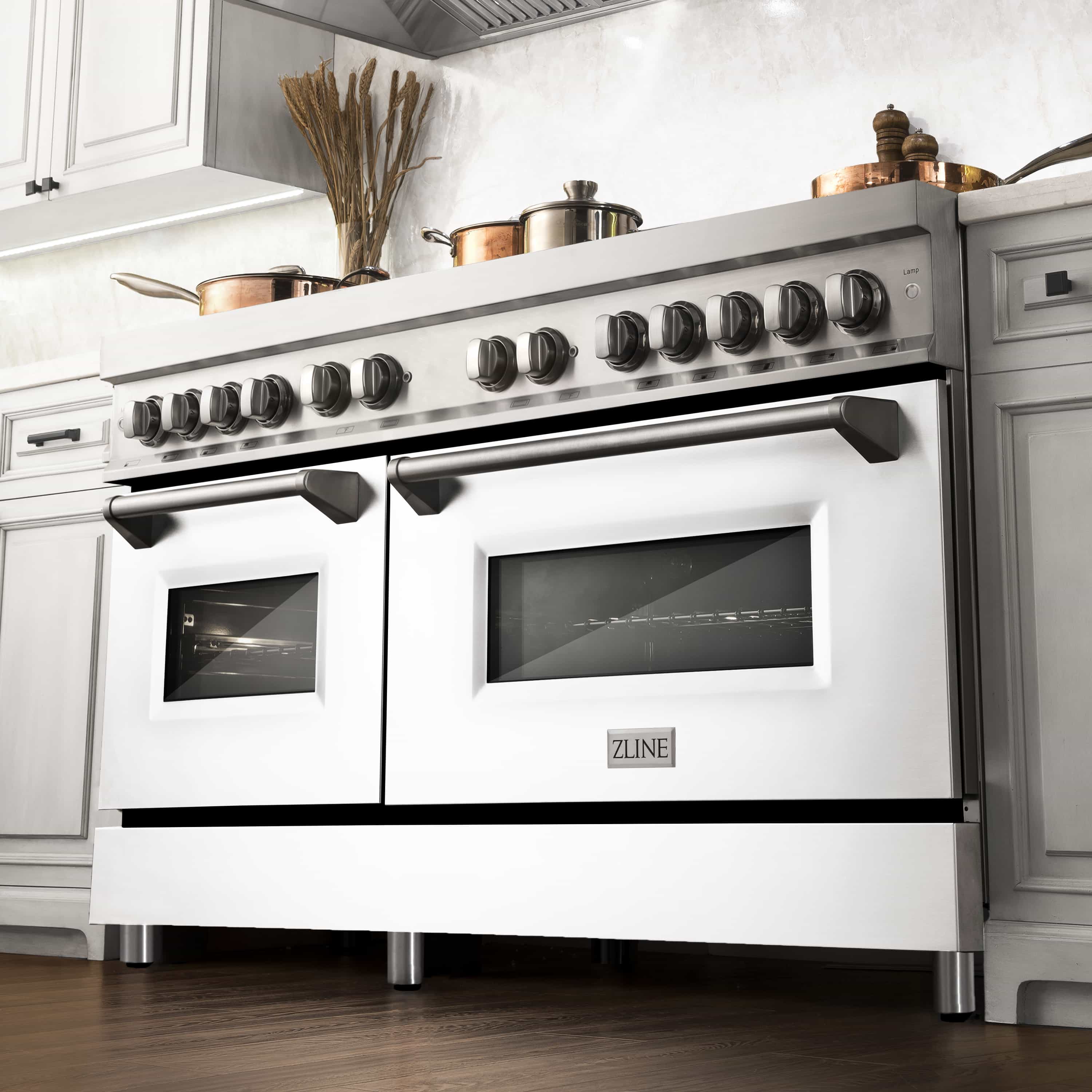 Stainless dual fuel range with knob row and white matte double oven doors