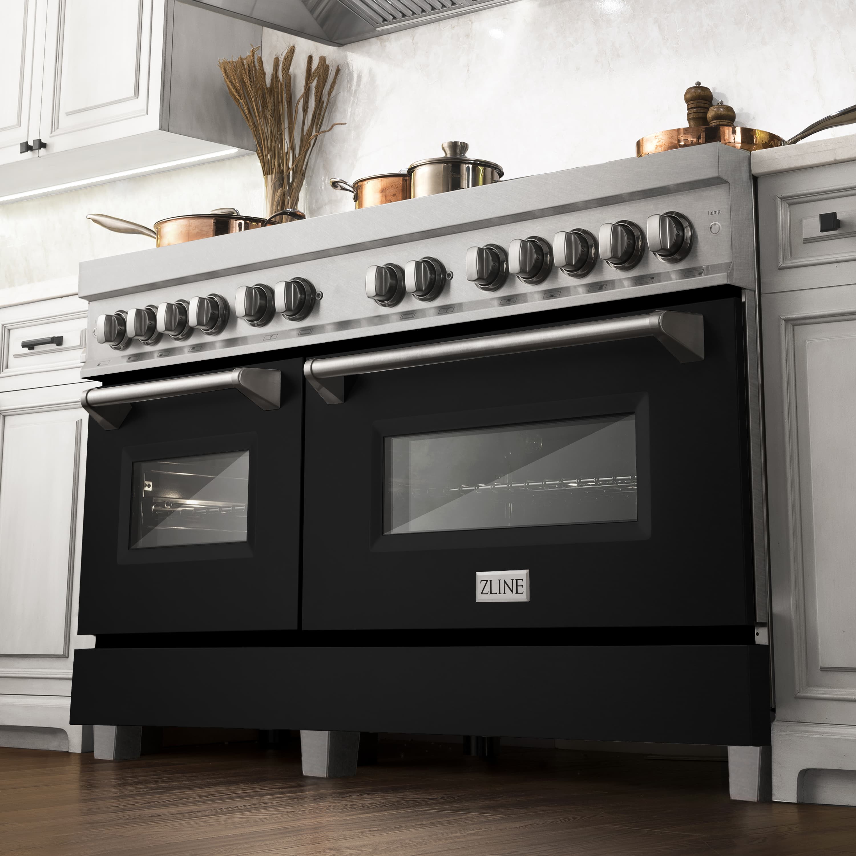 Dual fuel range in kitchen with stainless top, black doors, and ZLINE logo on panel