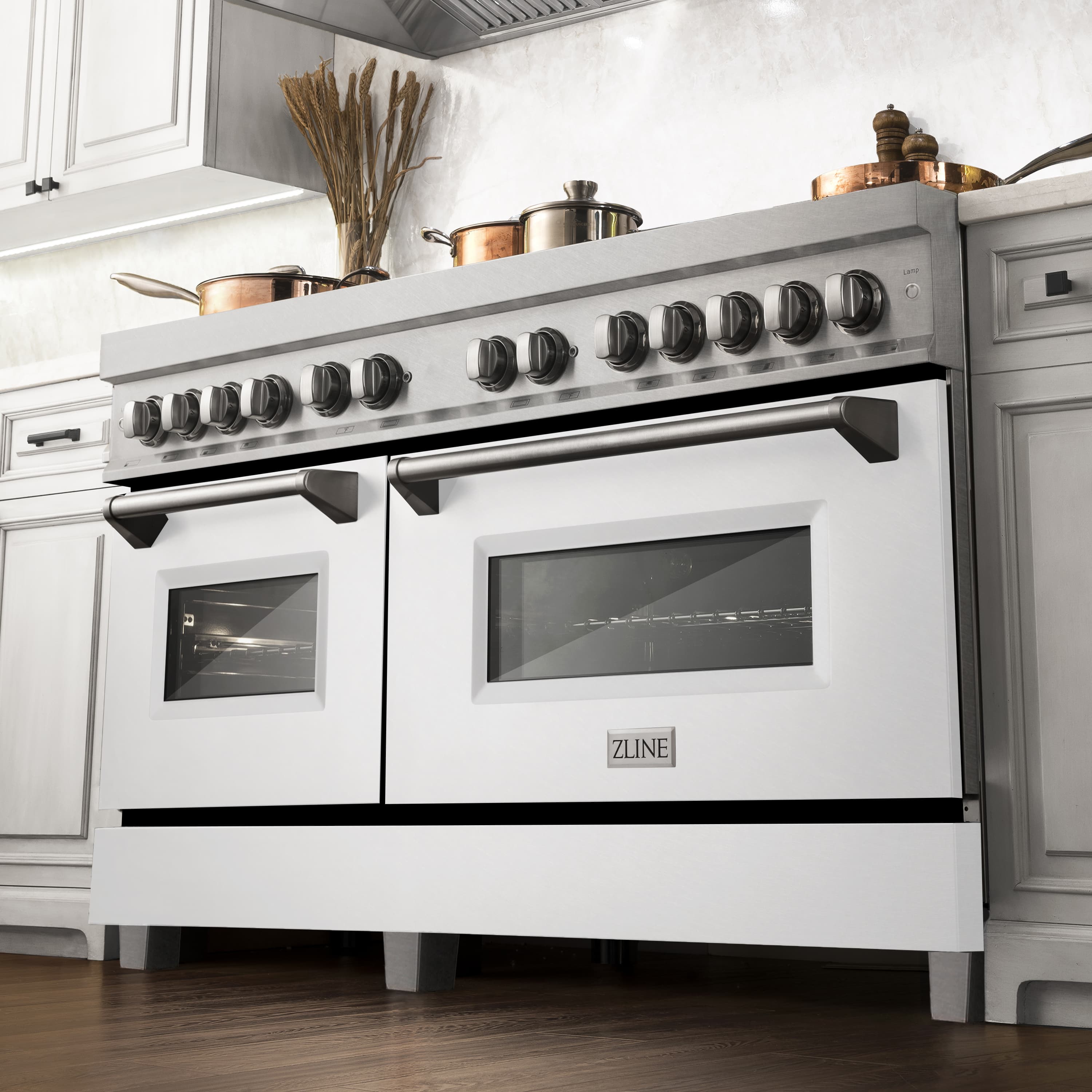 Dual fuel range in kitchen with stainless cooktop, oven doors, and control knobs