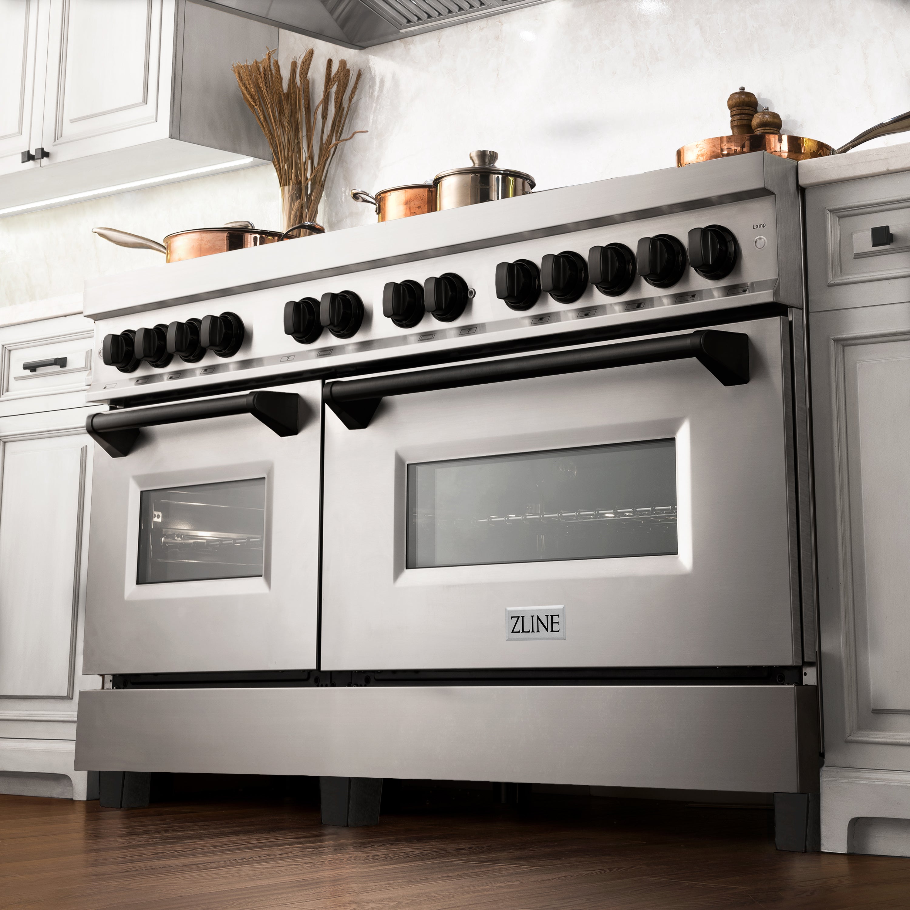 Stainless steel dual-fuel range with matte black grates, control knobs, and oven windows