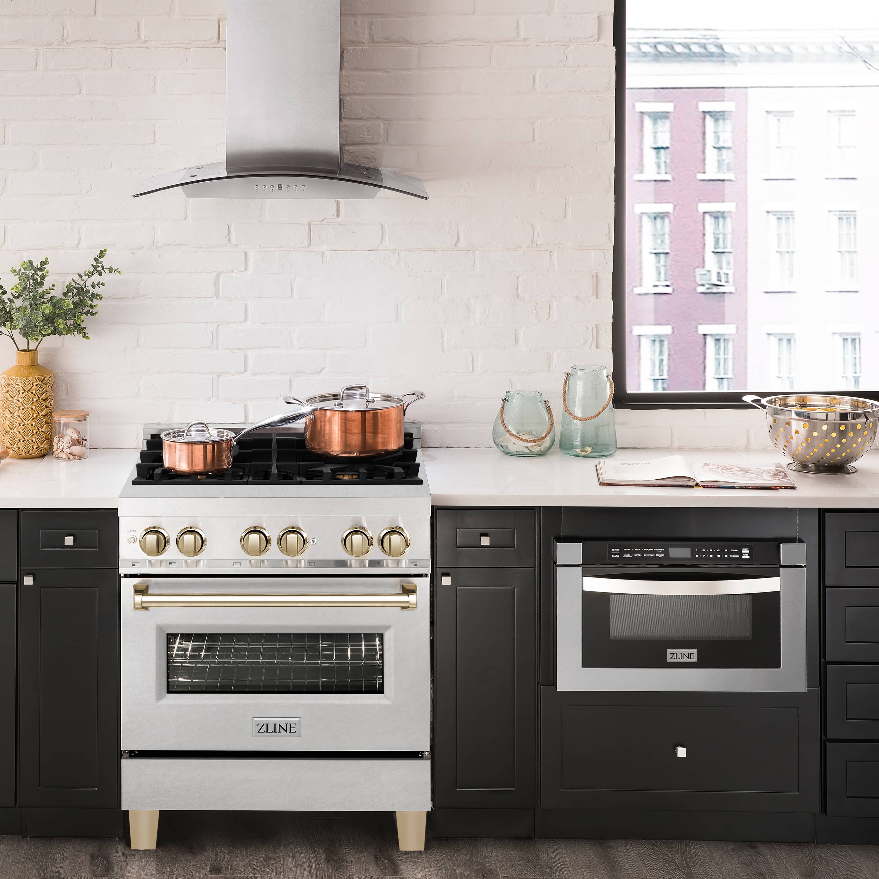 Fingerprint-resistant satin stainless range with gas cooktop, gold knobs, and oven door