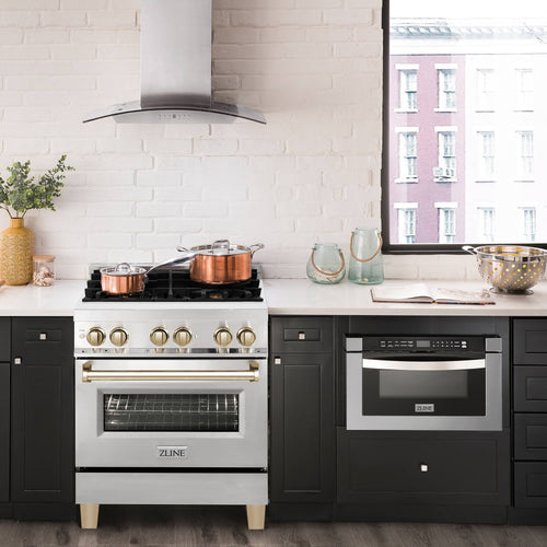 Dual fuel range with wall-mounted range hood above in kitchen