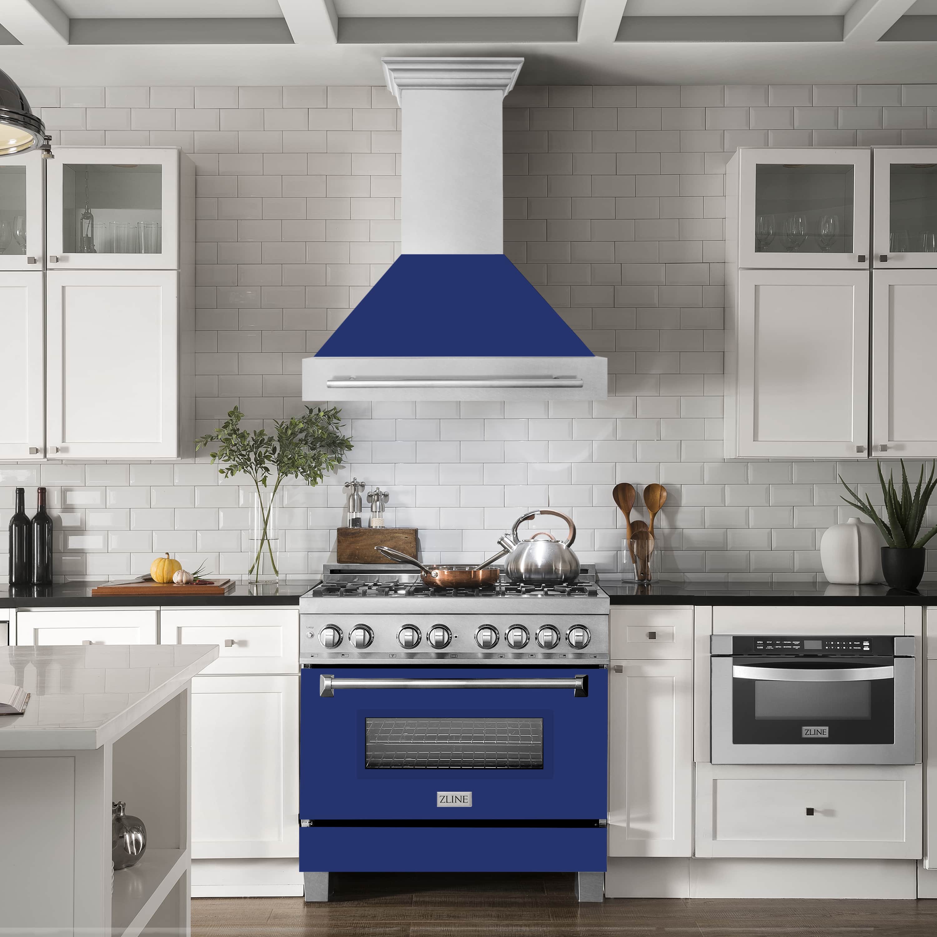 Stainless steel wall mount range hood over stove with blue glass shell
