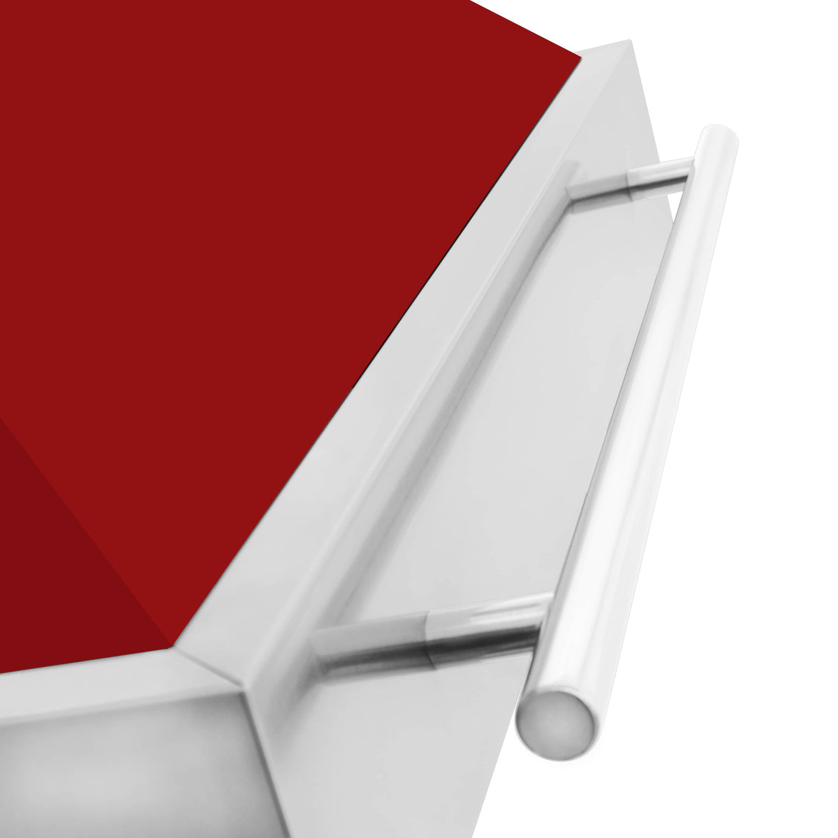 Close-up of stainless handle on wall mount range hood with red matte canopy