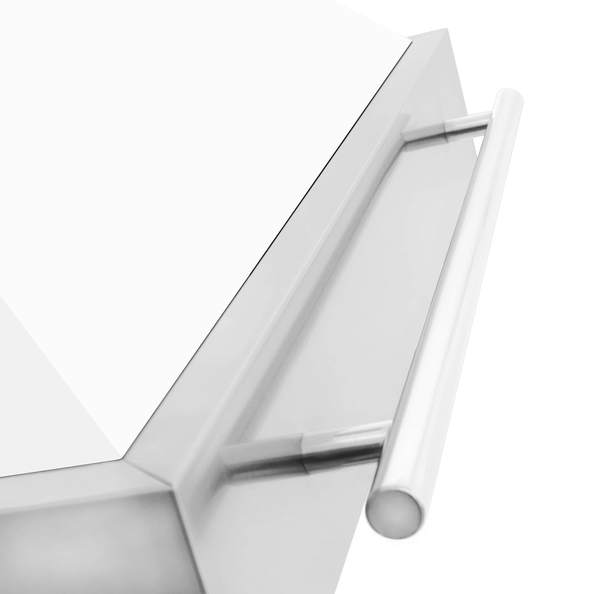 White matte chimney hood with stainless handle bar, angled close-up