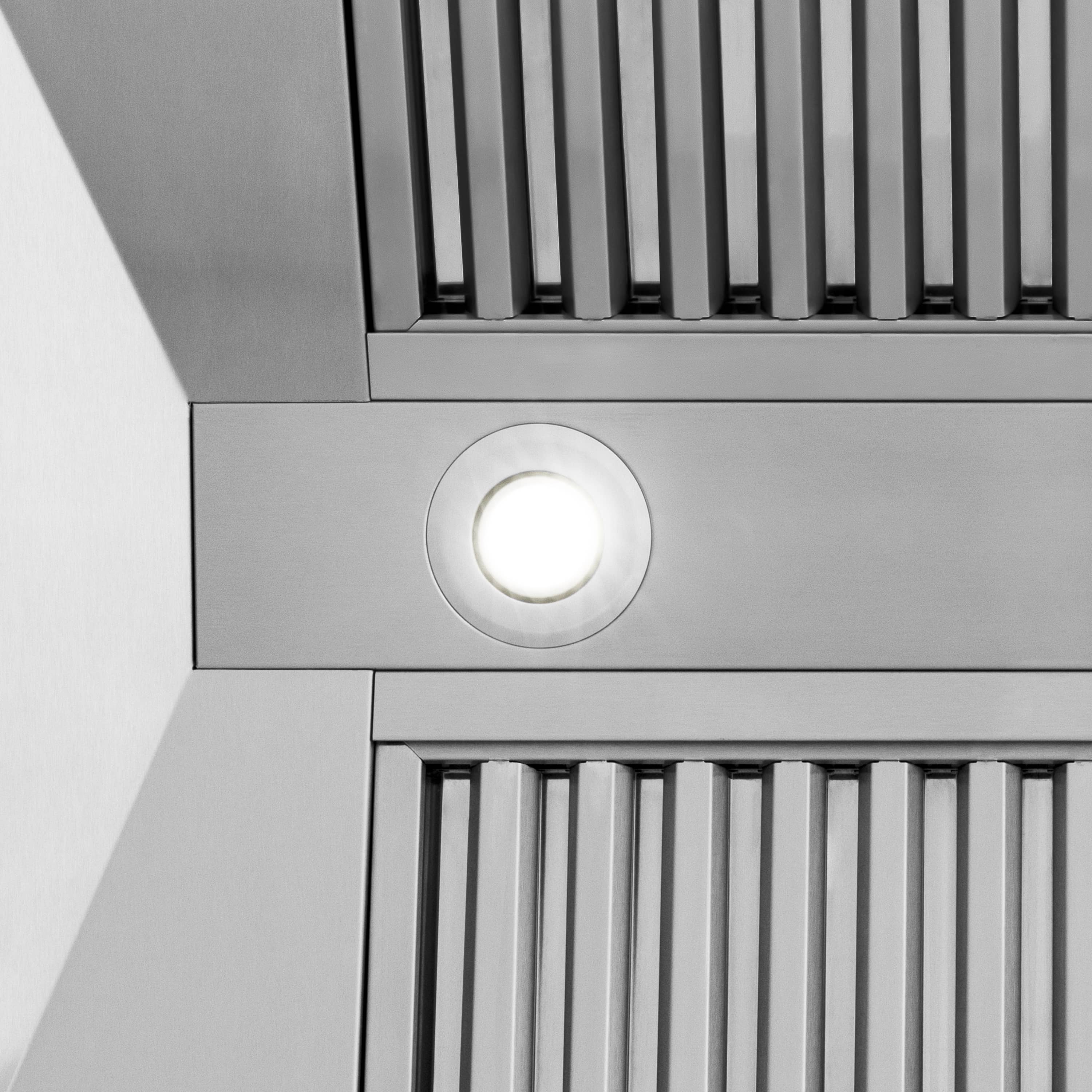 Stainless range hood vent grille with round light or button detail