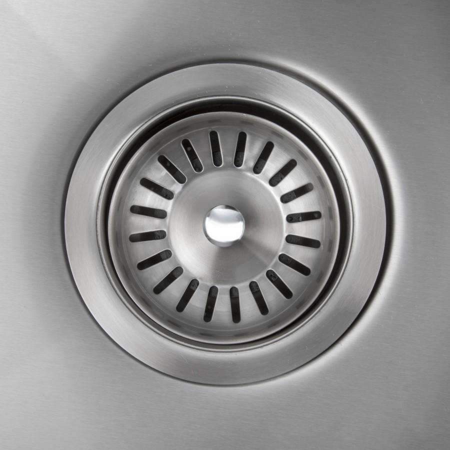 Stainless steel sink drain strainer with radial slots and central cover.