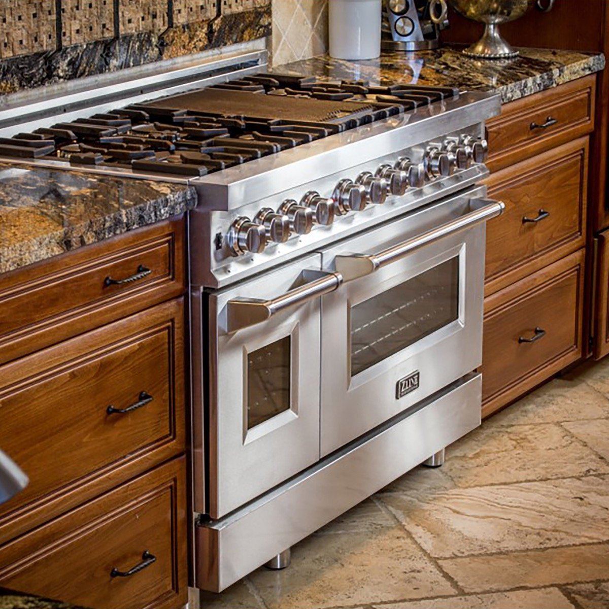 ZLINE stainless steel gas range with multiple burners and double oven doors