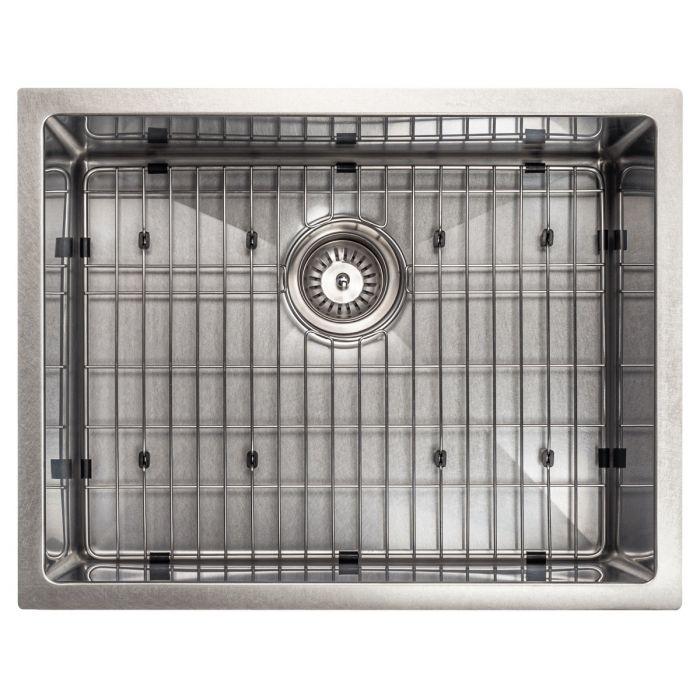 Single-bowl stainless steel sink with raised bottom rack grid and center drain.