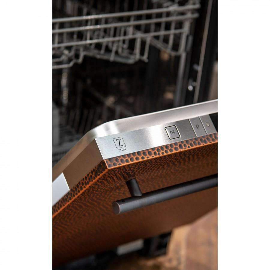 Close-up of modern handle on hand-hammered copper dishwasher door.