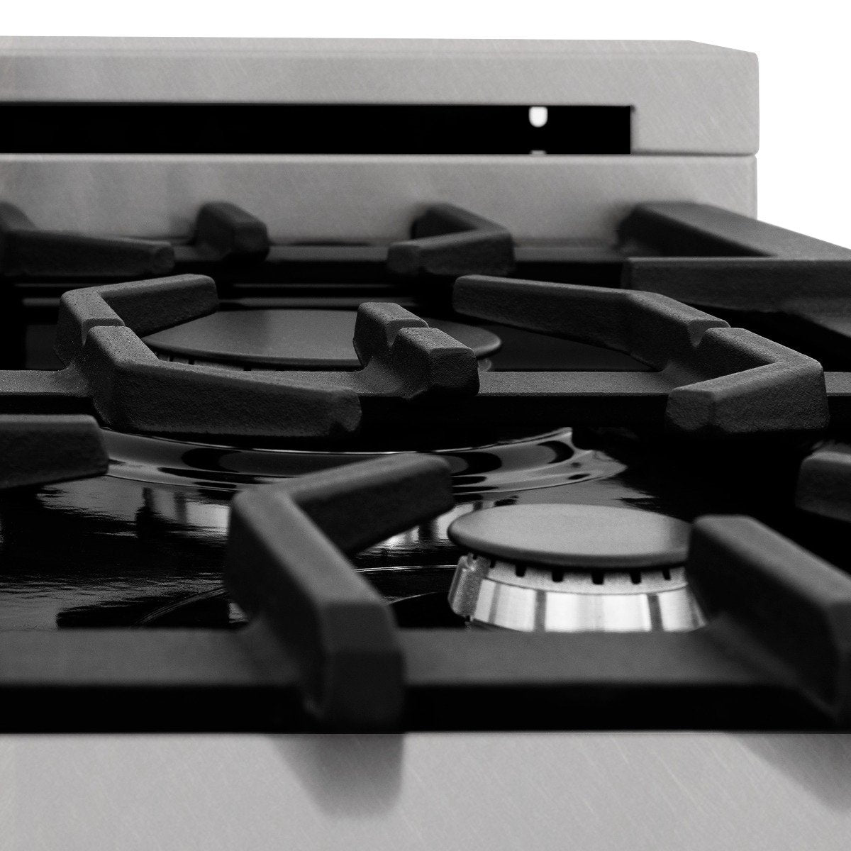 Dual fuel range cooktop with matte black grates and central burner cover detail