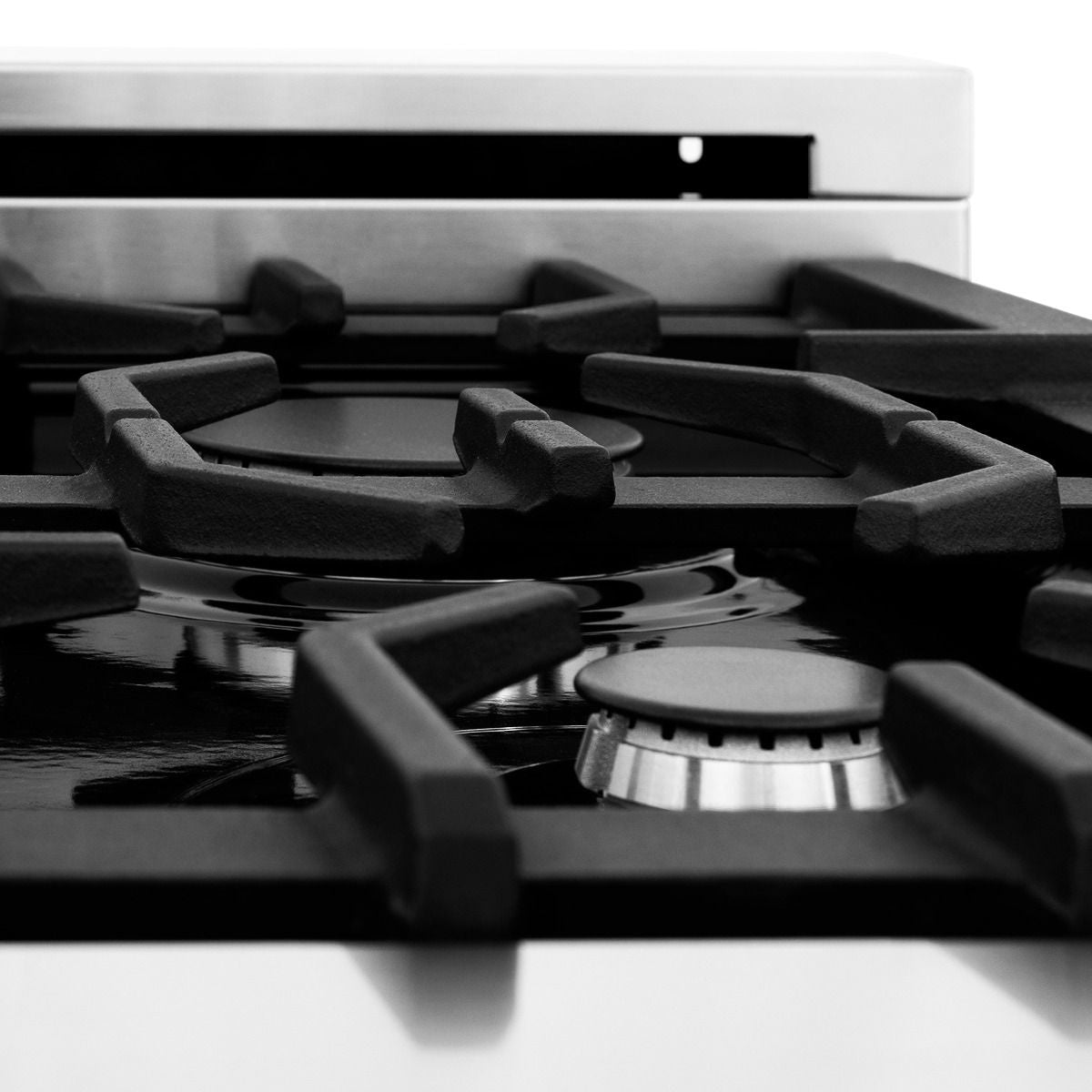 Stainless steel dual fuel range cooktop with black grates and burner caps