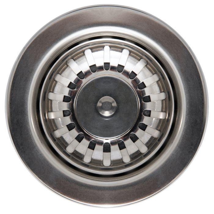Stainless drain strainer and circular drain opening in a white sink basin