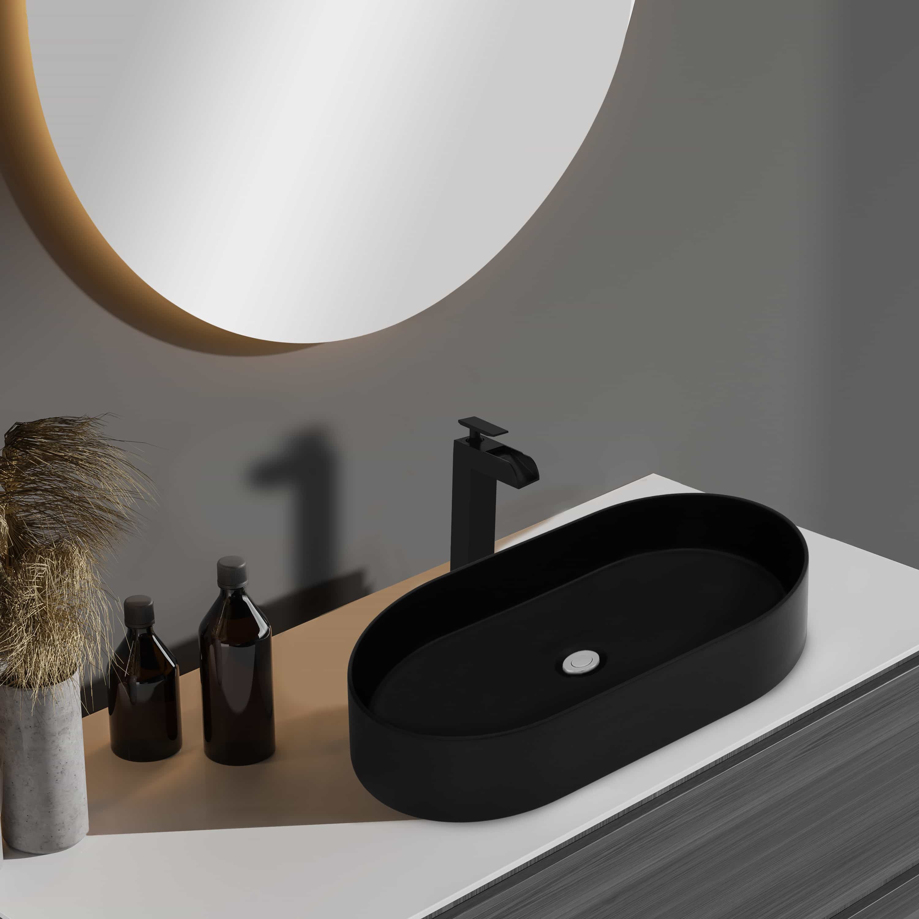Matte black oval vessel sink with drain hole on bathroom countertop