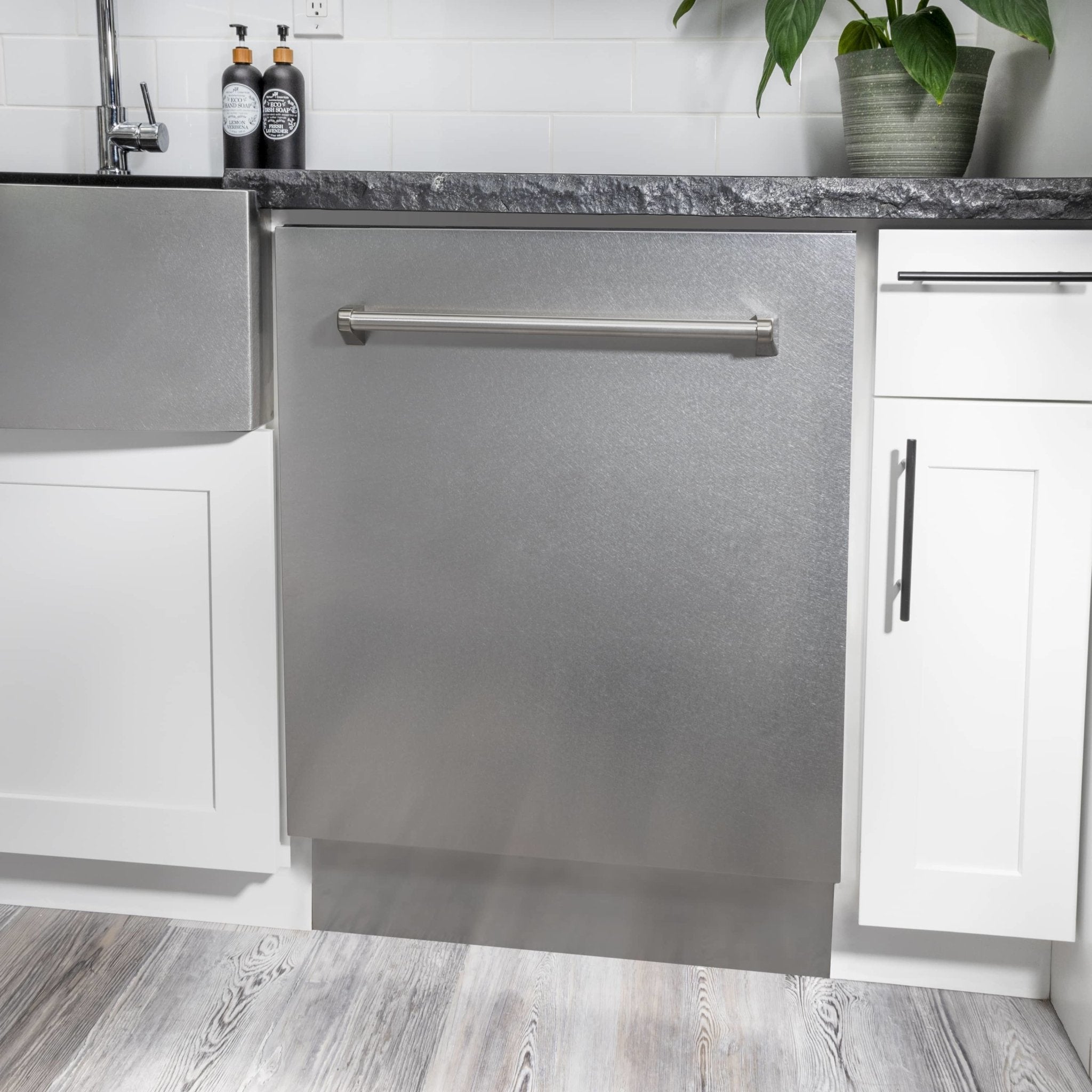 Satin stainless tall tub dishwasher installed under counter with handle visible