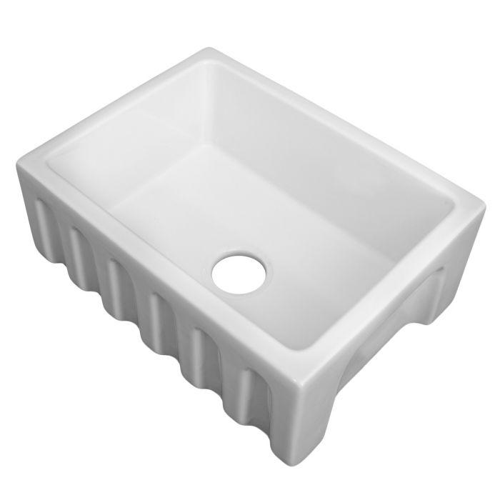White single-bowl fireclay kitchen sink with drain opening and apron-front profile