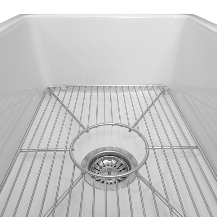 White single-bowl sink with stainless bottom grid over the drain opening