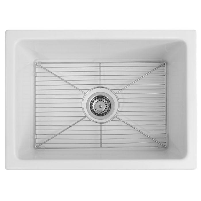White rectangular fireclay sink basin with drain opening and bottom grid rack