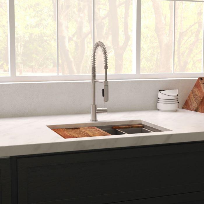 Undermount single-bowl stainless steel kitchen sink installed with faucet
