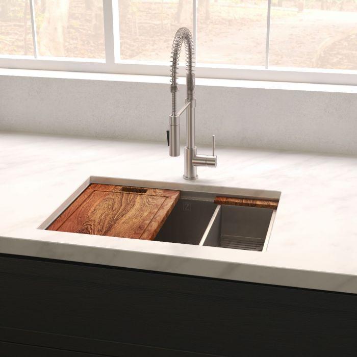 Single-bowl stainless steel kitchen sink installed with faucet and accessories