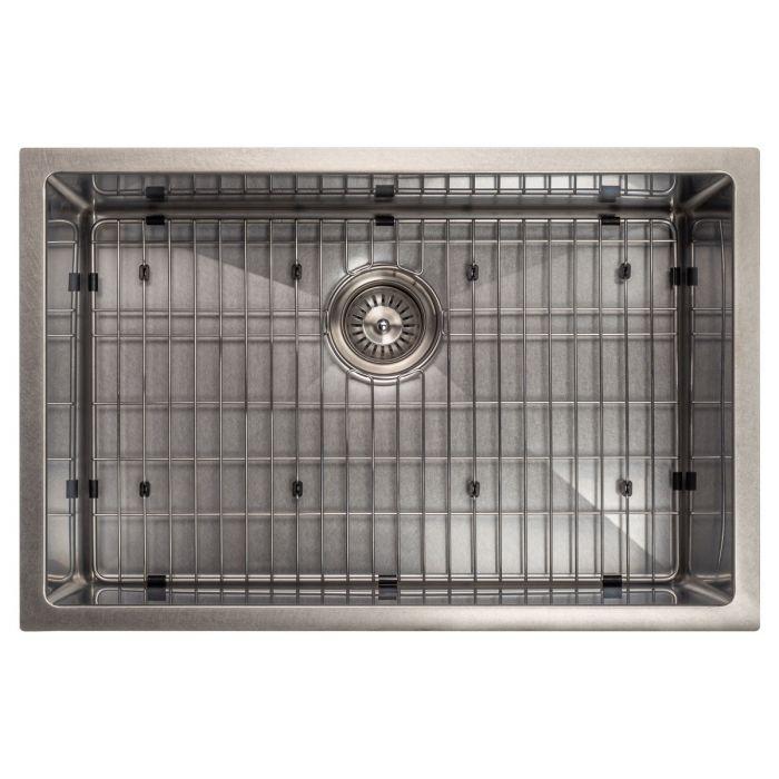 Stainless steel sink with fitted bottom grid and circular drain strainer
