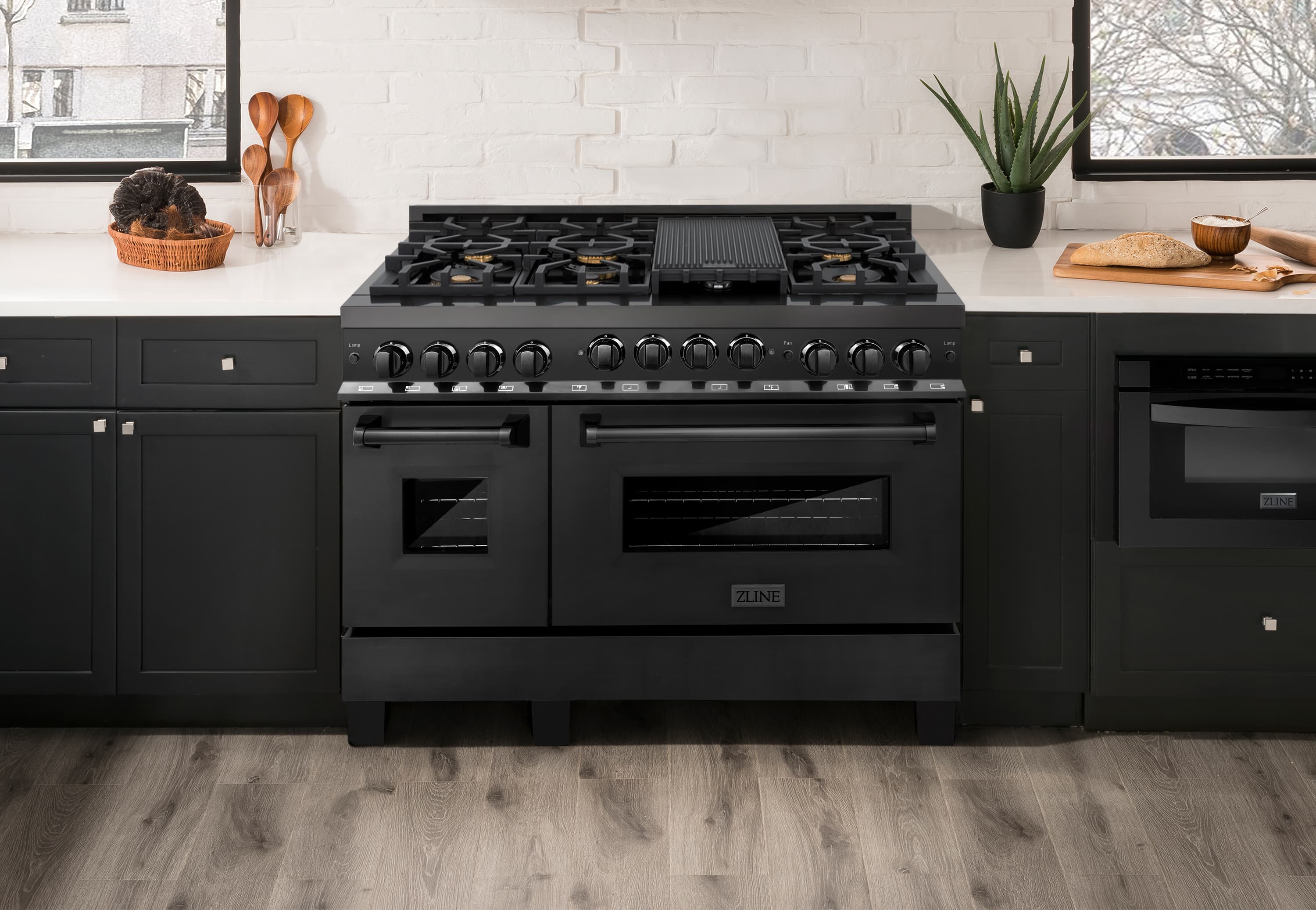 Black 48-inch gas range with front control knobs and oven doors