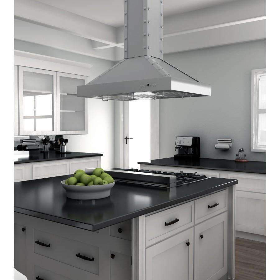 Stainless steel island range hood above kitchen cooktop, angled chimney