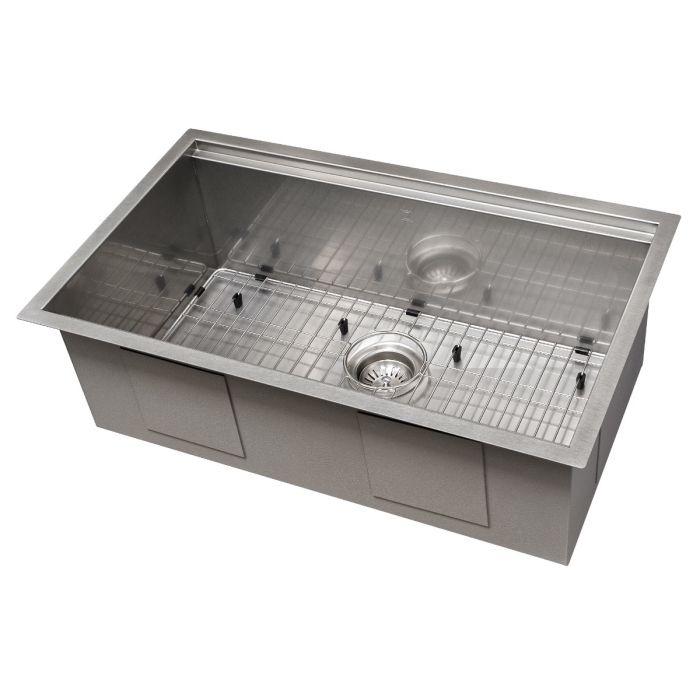 Single-bowl stainless steel kitchen sink with bottom grid and centered drain