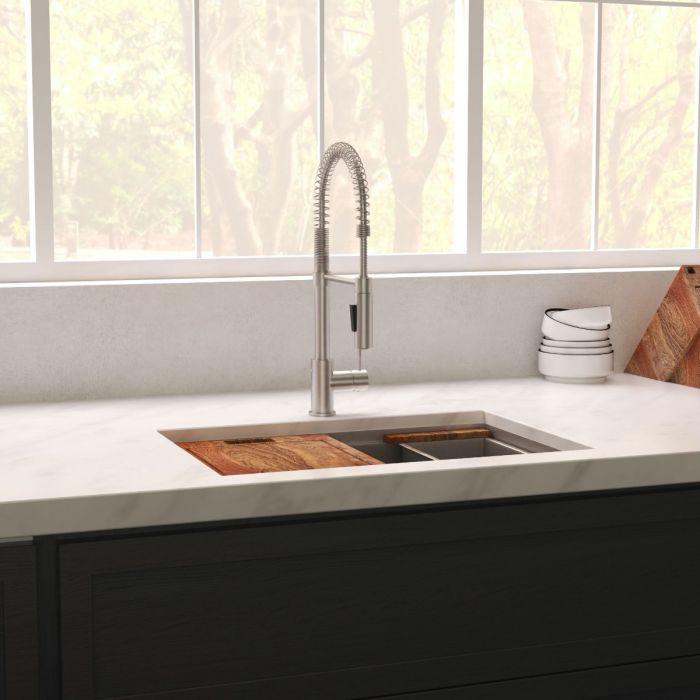 Single-bowl kitchen sink with cutting board panel and rectangular drain insert