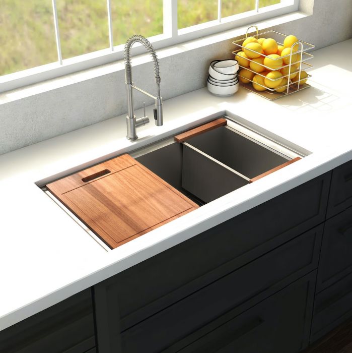 Stainless steel corner kitchen sink with wood cutting board, faucet, and strainer