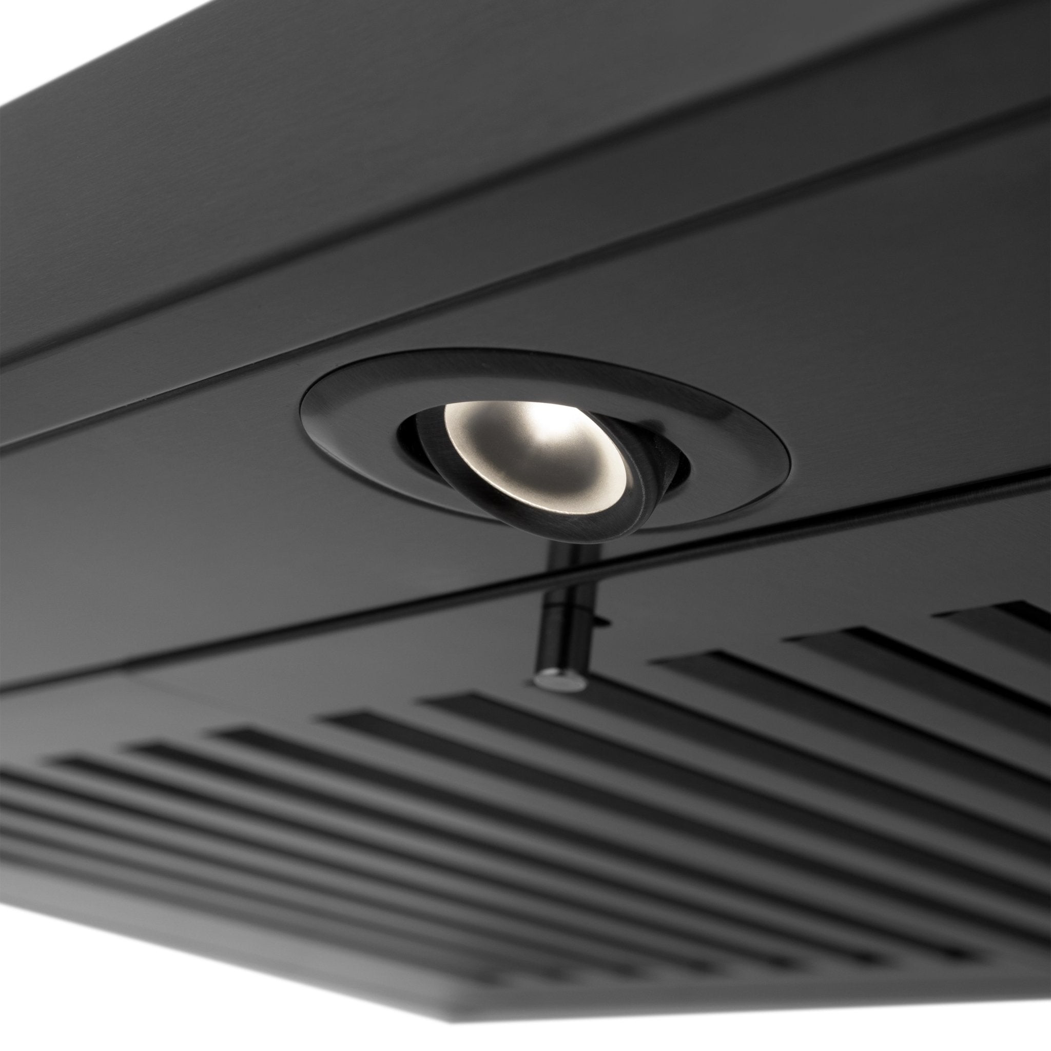 Black range hood underside with circular light and ventilation grilles