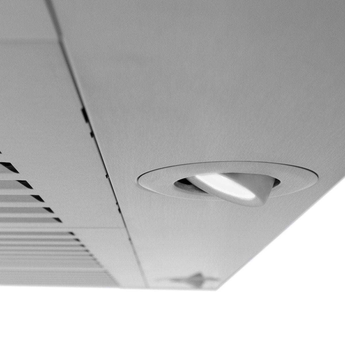 Stainless steel range hood interior with round recessed light