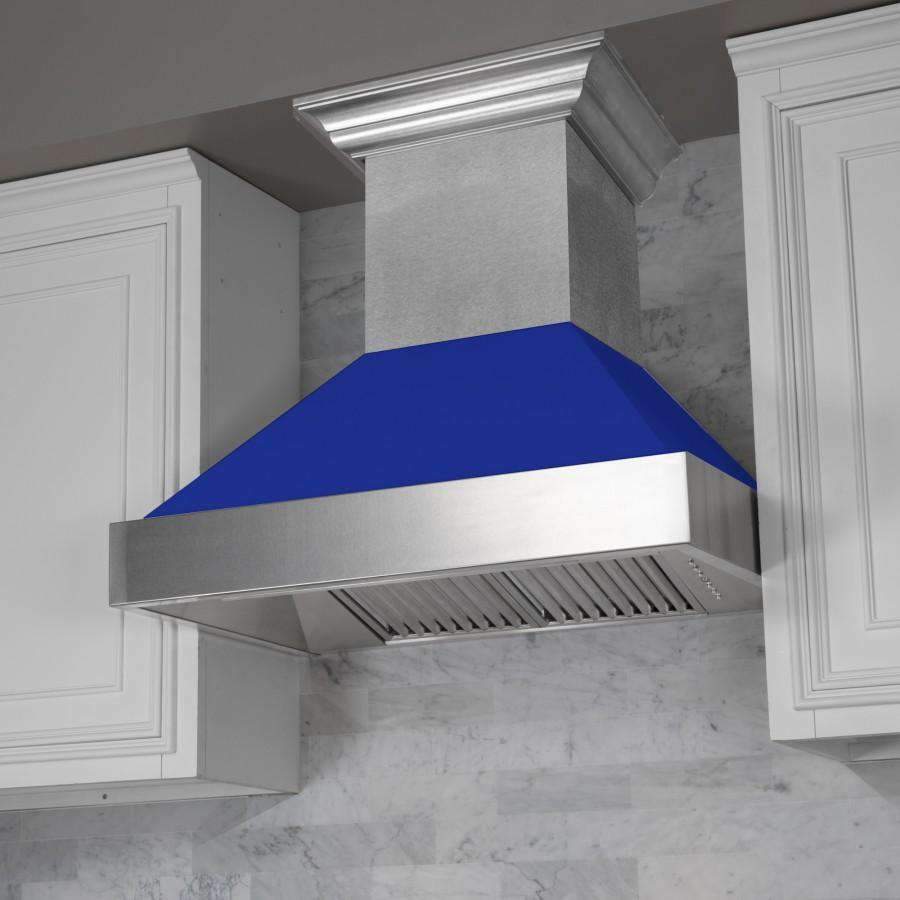 Ducted wall range hood with stainless chimney and blue matte canopy, angled view