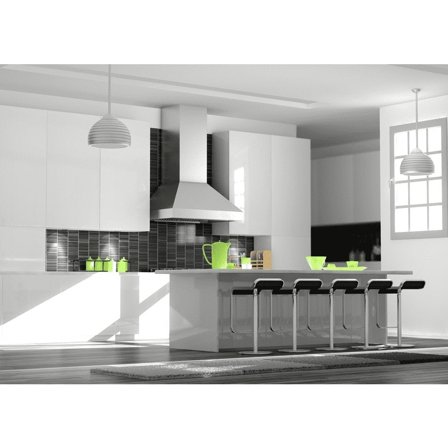 Stainless steel chimney range hood above stove with tiled backsplash