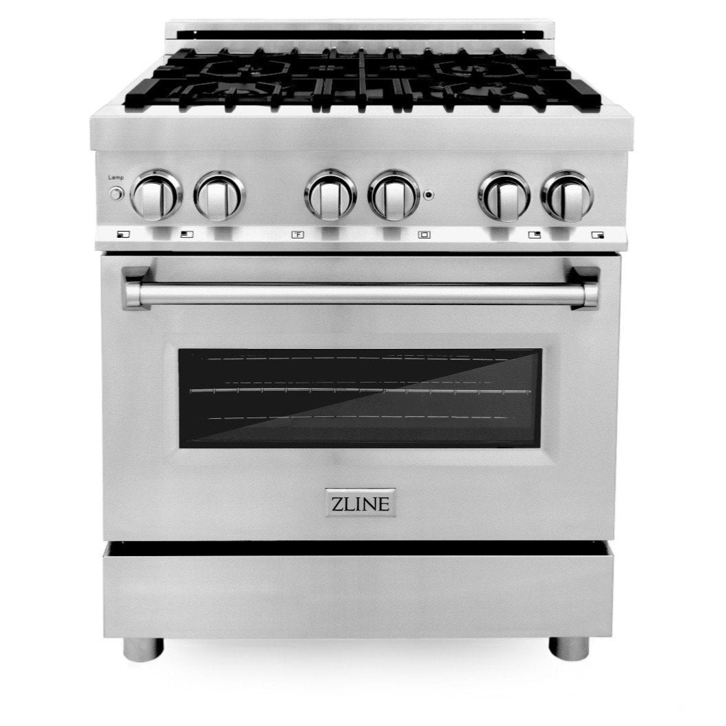 Stainless dual fuel range with black grates, brass burner caps, and control knobs, oven door.