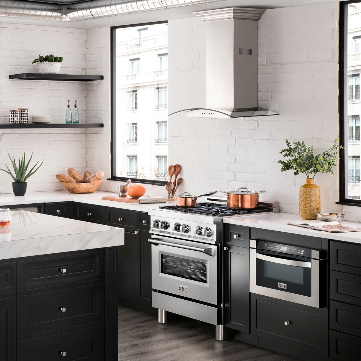 Stainless dual fuel range with four burners, black control knobs, and oven door.