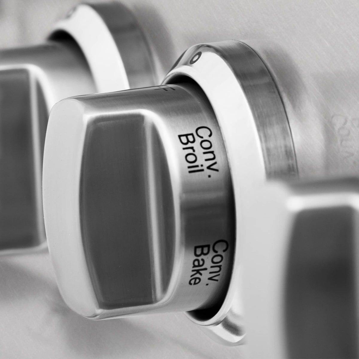 Stainless steel oven control dial labeled Roast, Broil, Bake, and Convection