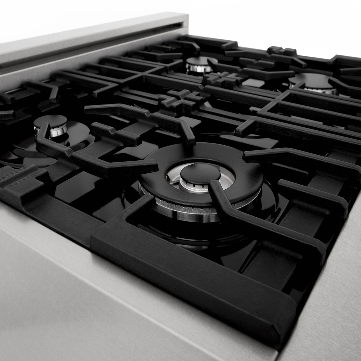 Black burner grates on cooktop with round burner ring detail