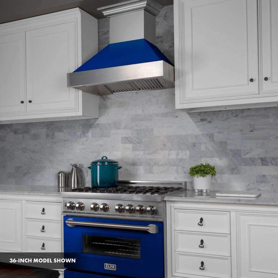 Dual fuel range with stainless cooktop, blue oven door, and wall-mounted range hood