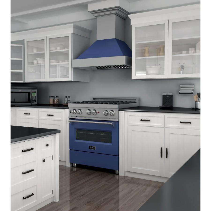 Dual fuel range in blue with stainless cooktop and knobs, built into a white kitchen