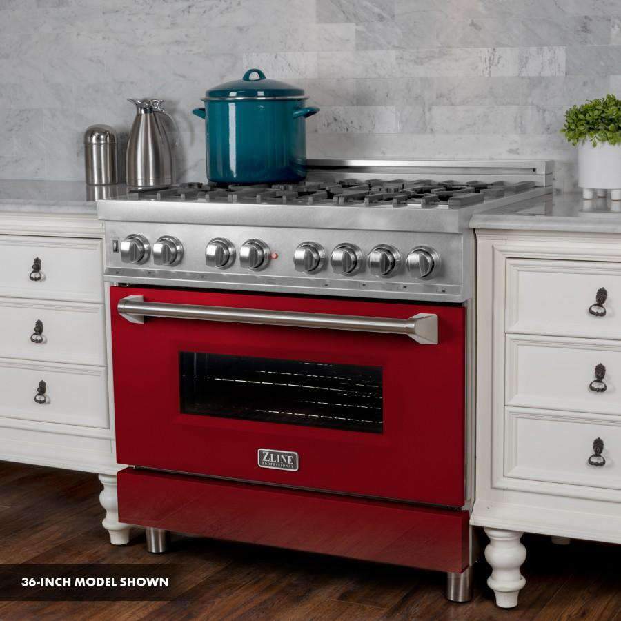 Red front dual-fuel range with stainless control knobs and black burner grates