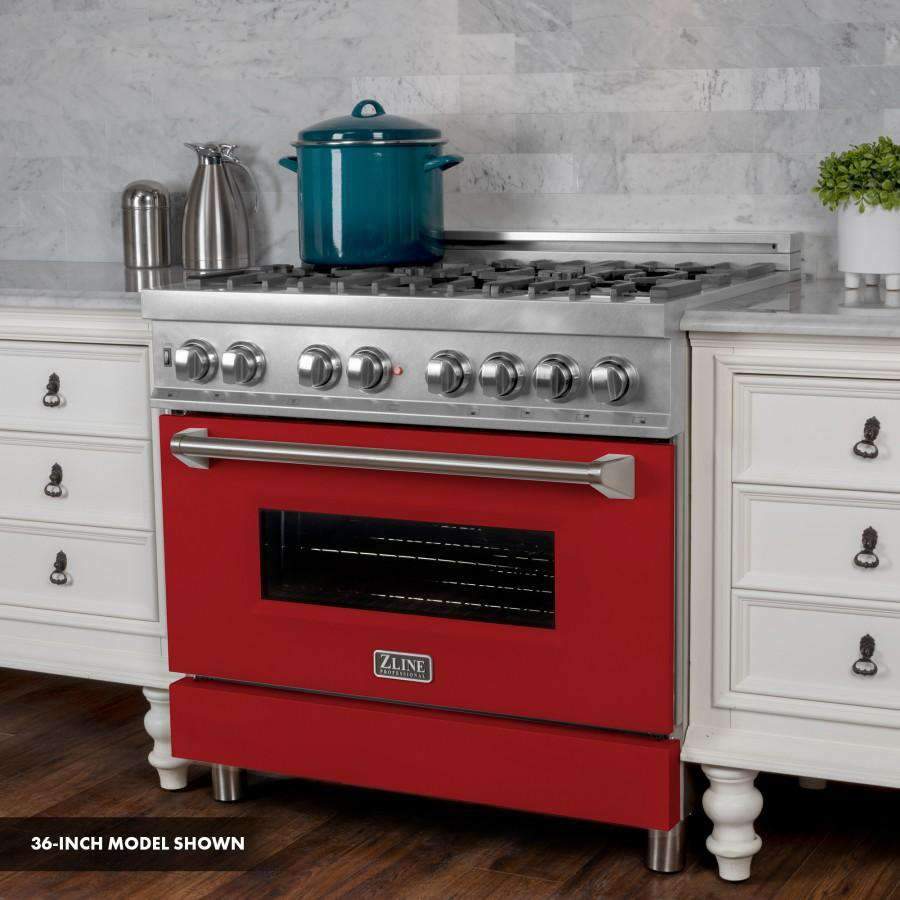 Stainless steel and red dual-fuel range with oven door and control knobs