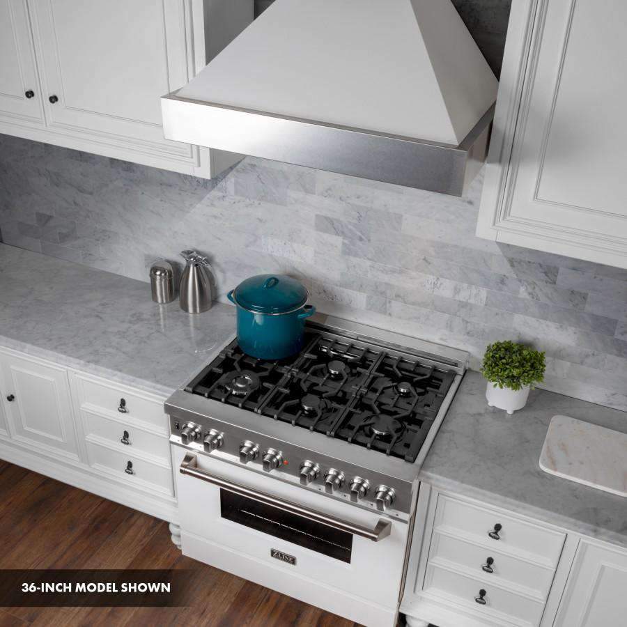 White and stainless dual fuel range cooktop with burners, knobs, and pot on grate