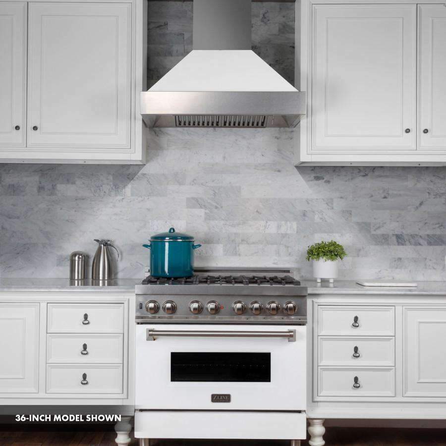 Dual fuel range with stainless cooktop grates, white matte oven door, and control knobs.