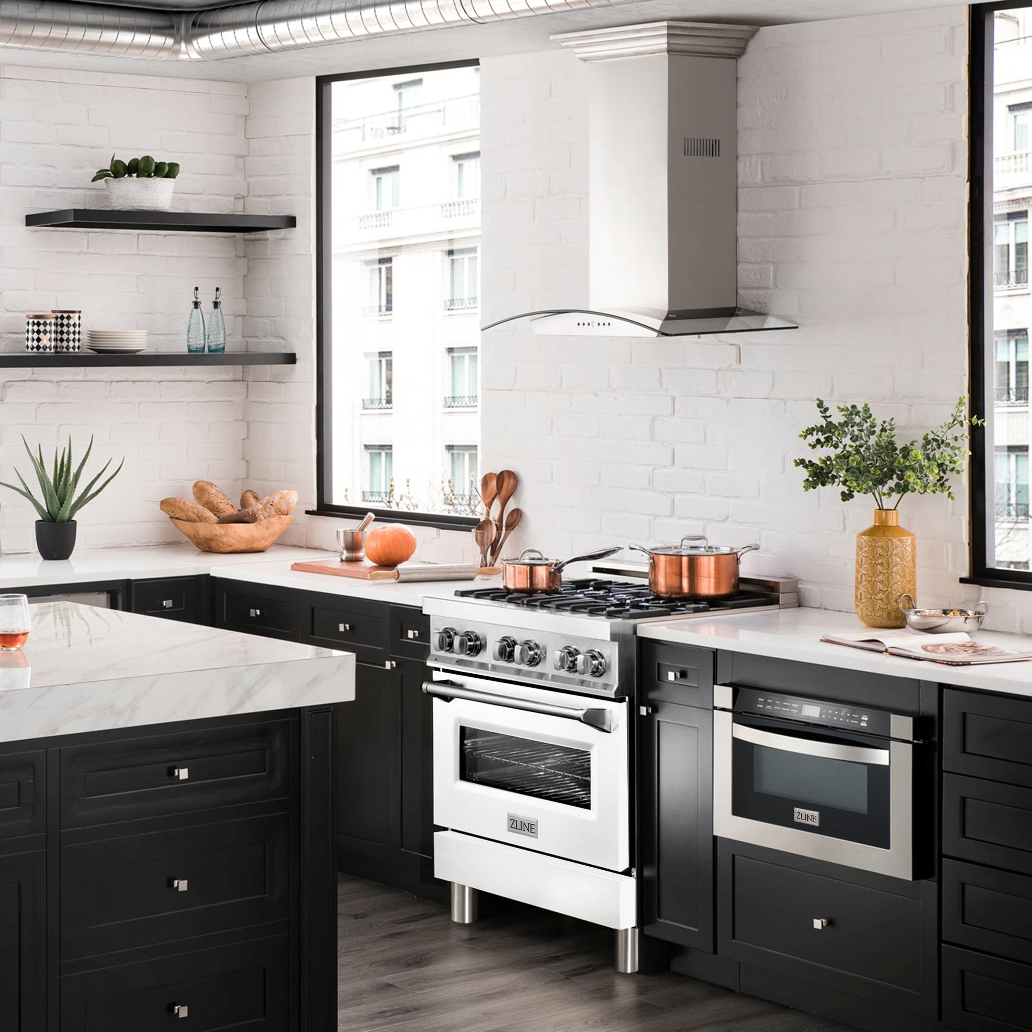 Freestanding dual fuel range with stainless burners and white oven door in kitchen