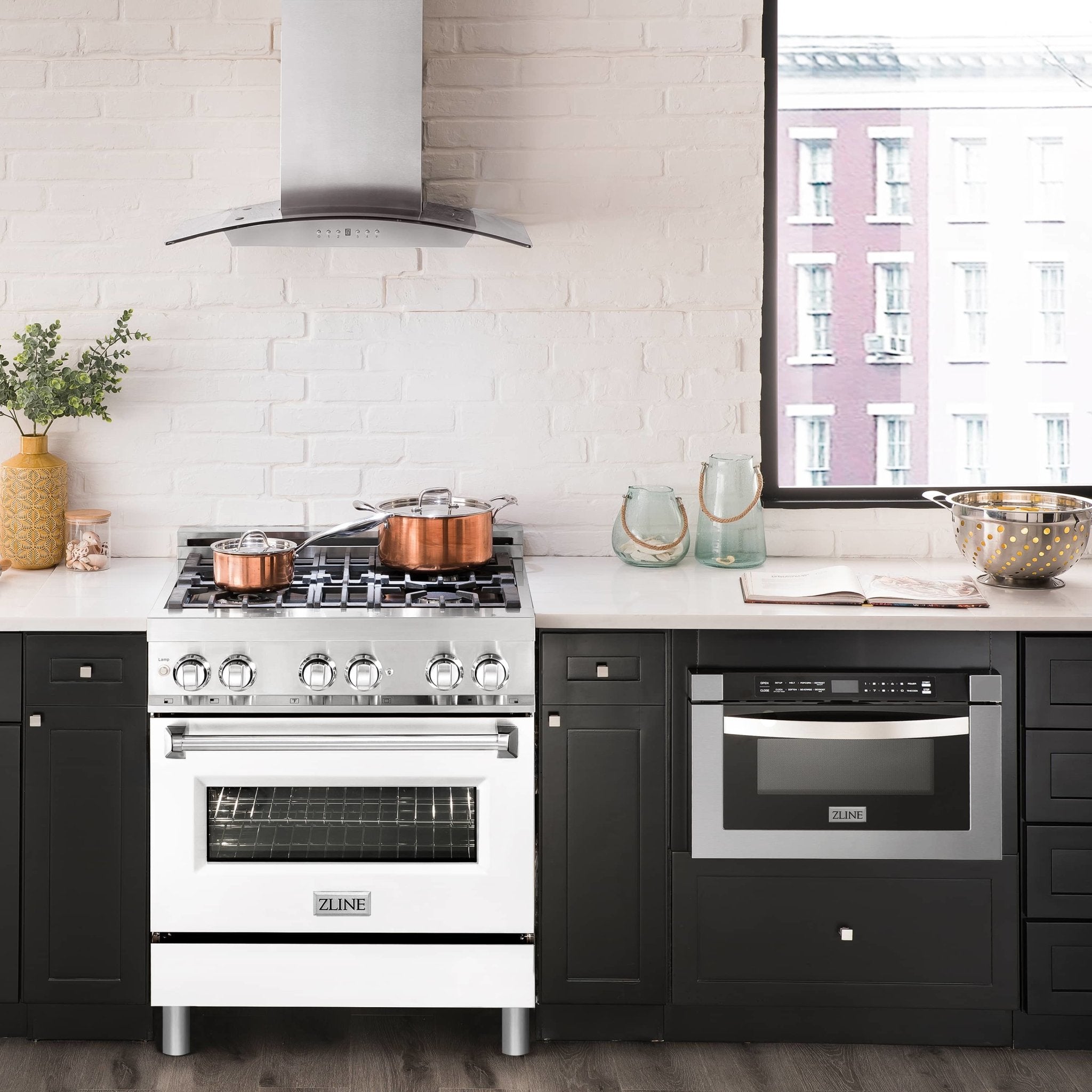 Dual fuel range front view with black cooktop grates and white oven door