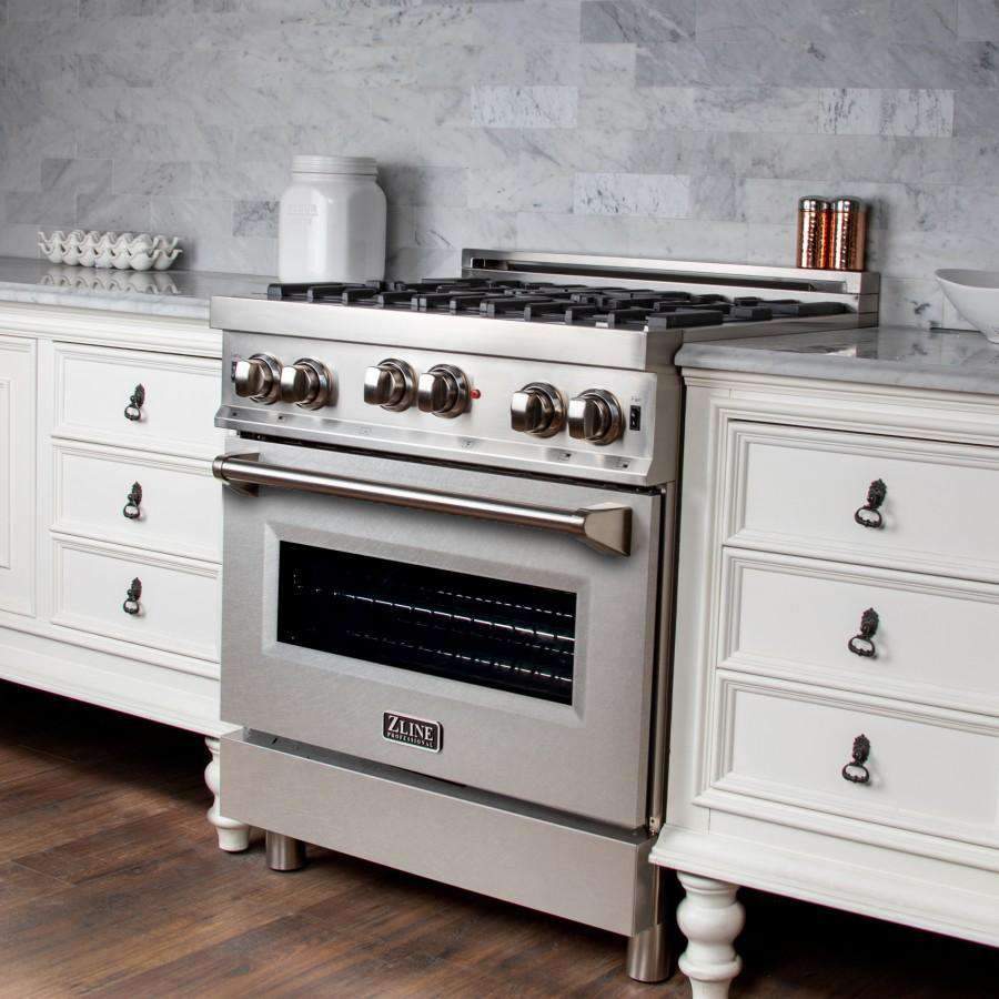 Stainless steel gas range with burner grates, control knobs, and oven door