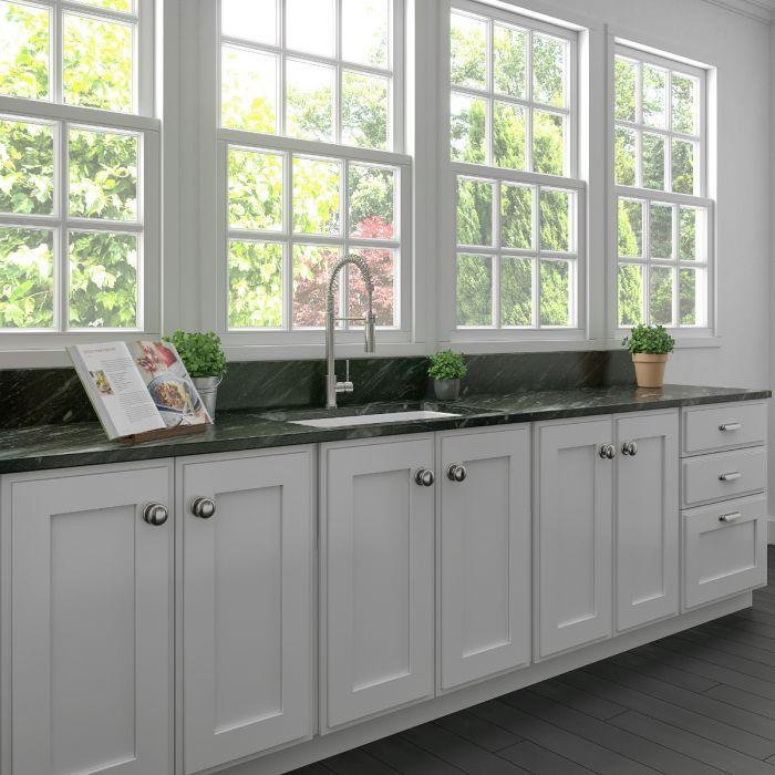 Matte white fireclay single-bowl kitchen sink installed on countertop