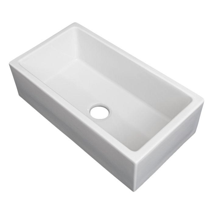 White rectangular single-bowl fireclay sink with centered drain hole, no grid